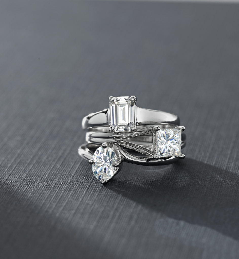 Stacked moissanite rings by Charles & Colvard