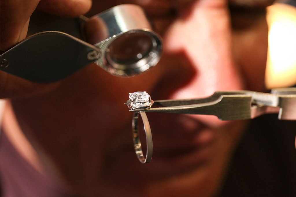 Professional Jeweler Evaluating Beautiful Ring